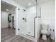 Modern bathroom boasting a glass-enclosed shower and convenient access to a walk-in closet at 3325 Horseshoe Dr, Longwood, FL 32779