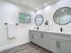 Contemporary bathroom featuring a double sink vanity, modern fixtures, and updated flooring at 3325 Horseshoe Dr, Longwood, FL 32779