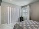 Bedroom featuring clean, white walls, large closet, and marble tile flooring at 3325 Horseshoe Dr, Longwood, FL 32779