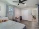 Cozy bedroom with hardwood floors, a ceiling fan, and a closet with paneled doors at 3325 Horseshoe Dr, Longwood, FL 32779