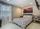Bright bedroom with a patterned comforter, shelving and large window at 3325 Horseshoe Dr, Longwood, FL 32779