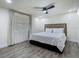 Modern bedroom with contemporary lighting, plush headboard, and updated flooring at 3325 Horseshoe Dr, Longwood, FL 32779