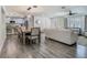Open concept dining room leading into the living room and modern kitchen with stainless steel appliances at 3325 Horseshoe Dr, Longwood, FL 32779
