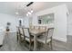 Spacious dining area featuring a modern light fixture, open to the living room and other living spaces at 3325 Horseshoe Dr, Longwood, FL 32779