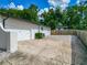 Home exterior featuring a two-car garage, long driveway, and fenced-in yard at 3325 Horseshoe Dr, Longwood, FL 32779