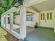 Covered front porch with decorative columns and a double door at 3325 Horseshoe Dr, Longwood, FL 32779