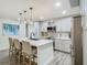 Updated kitchen boasting stainless steel appliances, modern cabinetry, an island with bar seating and pendant lighting at 3325 Horseshoe Dr, Longwood, FL 32779