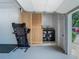 Garage space features a laundry area with stacked washer and dryer hidden behind a sliding door at 3325 Horseshoe Dr, Longwood, FL 32779