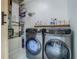 Convenient laundry room with updated, gray front loading washer and dryer appliances at 3325 Horseshoe Dr, Longwood, FL 32779