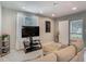 Bright living room features modern decor, neutral colors, and an open layout to the outside at 3325 Horseshoe Dr, Longwood, FL 32779