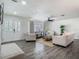 Cozy living room with modern decor, wood floors, and bright natural light at 3325 Horseshoe Dr, Longwood, FL 32779