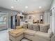Open-concept living room and modern kitchen seamlessly blend, with stainless appliances and recessed lighting at 3325 Horseshoe Dr, Longwood, FL 32779