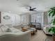 Relaxing living room with stylish furniture, a ceiling fan, and wood-look flooring at 3325 Horseshoe Dr, Longwood, FL 32779
