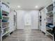 Spacious walk-in closet with custom shelves and drawers, connecting to the bathroom at 3325 Horseshoe Dr, Longwood, FL 32779