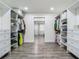 Large walk-in closet with ample storage solutions, including built-in shelves and drawers at 3325 Horseshoe Dr, Longwood, FL 32779
