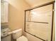 Bathroom featuring a tub with glass doors and granite countertop vanity at 338 Roberts Family Ln, Winter Springs, FL 32708