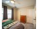 Bright bedroom with a comfortable bed, dresser, and ample natural light at 338 Roberts Family Ln, Winter Springs, FL 32708
