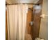 Close-up of a shower area featuring neutral-toned tile work and essential fixtures for a comfortable bathing experience at 338 Roberts Family Ln, Winter Springs, FL 32708