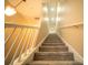 Upward view of the carpeted staircase featuring white railings, creating an aesthetic appeal at 338 Roberts Family Ln, Winter Springs, FL 32708
