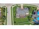 Home aerial view showing a private screened-in lanai, lush landscaping, and paver driveway in a prime location at 3656 Heirloom Rose Pl, Oviedo, FL 32766