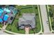 Expansive estate home featuring lush landscaping, brick drive, screened lanai, and a sparkling pool in a private backyard at 3656 Heirloom Rose Pl, Oviedo, FL 32766