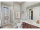 A well-lit bathroom features a glass shower, a toilet with white lid, and towels hanging at 3656 Heirloom Rose Pl, Oviedo, FL 32766