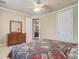 Bedroom featuring neutral carpet, ceiling fan, and view to en-suite bathroom at 3656 Heirloom Rose Pl, Oviedo, FL 32766