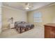 Bedroom featuring neutral carpet, ceiling fan, and a window to the outside at 3656 Heirloom Rose Pl, Oviedo, FL 32766