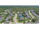 Community aerial showcasing a variety of homes, mature trees, and a serene lake in a desirable location at 3656 Heirloom Rose Pl, Oviedo, FL 32766