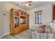 Upstairs living area features a comfortable sofa and large media center, perfect for relaxation and entertainment at 3656 Heirloom Rose Pl, Oviedo, FL 32766