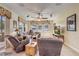 Spacious living room with a ceiling fan, recessed lighting, large windows, and comfortable furniture at 3656 Heirloom Rose Pl, Oviedo, FL 32766