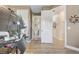 View of the office space and hallway highlighting the floorplan and natural lighting at 3656 Heirloom Rose Pl, Oviedo, FL 32766