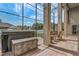 Enclosed outdoor patio with brick floors, a hot tub, and multiple seating areas at 3656 Heirloom Rose Pl, Oviedo, FL 32766