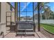 Enclosed outdoor patio with brick floors, a hot tub, and view to yard at 3656 Heirloom Rose Pl, Oviedo, FL 32766