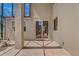 A covered patio features brick pavers and sliding glass doors to a sunlit, neutral-toned home exterior at 3656 Heirloom Rose Pl, Oviedo, FL 32766