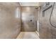 Modern shower featuring bronze colored walls, window and an overhead shower head at 3656 Heirloom Rose Pl, Oviedo, FL 32766