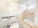 Bathroom featuring granite countertops, dual sinks and a tiled shower at 398 Citrus Isle Loop, Davenport, FL 33837