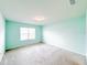 Carpeted bedroom featuring ample natural light from the window and fresh paint at 398 Citrus Isle Loop, Davenport, FL 33837