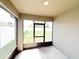 Covered patio with an exterior view and a screen door leading to the backyard at 398 Citrus Isle Loop, Davenport, FL 33837