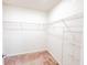 Spacious walk-in closet featuring ample shelving and plush carpeting at 398 Citrus Isle Loop, Davenport, FL 33837