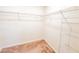 Walk-in closet with ventilated shelving and neutral carpet at 398 Citrus Isle Loop, Davenport, FL 33837