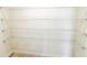 Walk-in closet with ventilated shelving and tile flooring at 398 Citrus Isle Loop, Davenport, FL 33837