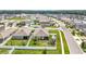 Aerial view shows a beautiful neighborhood with a large backyard and a well-kept lawn at 3980 Gadwall Pl, Leesburg, FL 34748