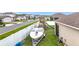 Well-maintained backyard featuring a parked boat, play structure, and privacy fence at 3980 Gadwall Pl, Leesburg, FL 34748