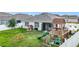 Picture of a well-manicured backyard with patio, playset, boat, and fenced perimeter at 3980 Gadwall Pl, Leesburg, FL 34748