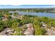Aerial view of the community showing proximity to the lake and surrounding tree coverage at 411 Meadowood Blvd, Fern Park, FL 32730
