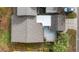 Aerial view of the home showing the backyard patio and landscaping, plus roof and driveway at 411 Meadowood Blvd, Fern Park, FL 32730