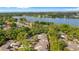 Aerial view of the community showing proximity to the lake and surrounding tree coverage at 411 Meadowood Blvd, Fern Park, FL 32730