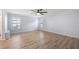 Spacious, airy bedroom with ample natural light and wood-look floors at 411 Meadowood Blvd, Fern Park, FL 32730