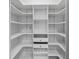 Walk-in closet featuring custom shelving and drawer units perfect for organization at 411 Meadowood Blvd, Fern Park, FL 32730
